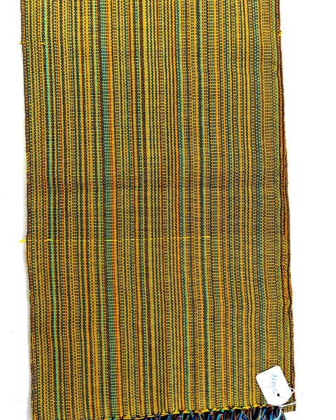 A turmeric-gold stole, teal threads running its length
