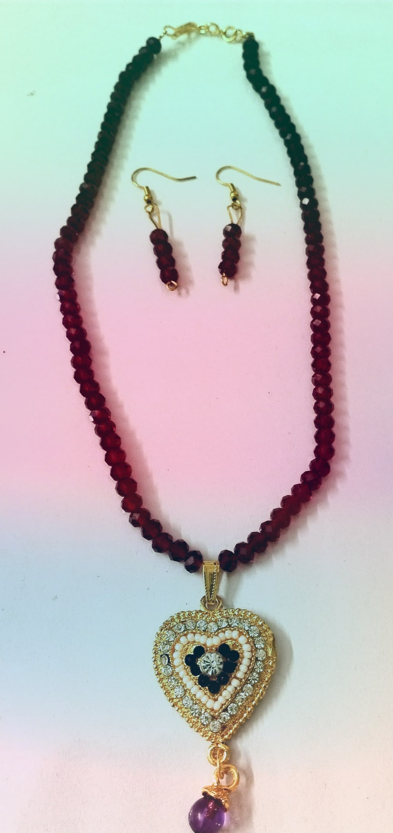 Necklace and earring set — black with a gold heart pendant