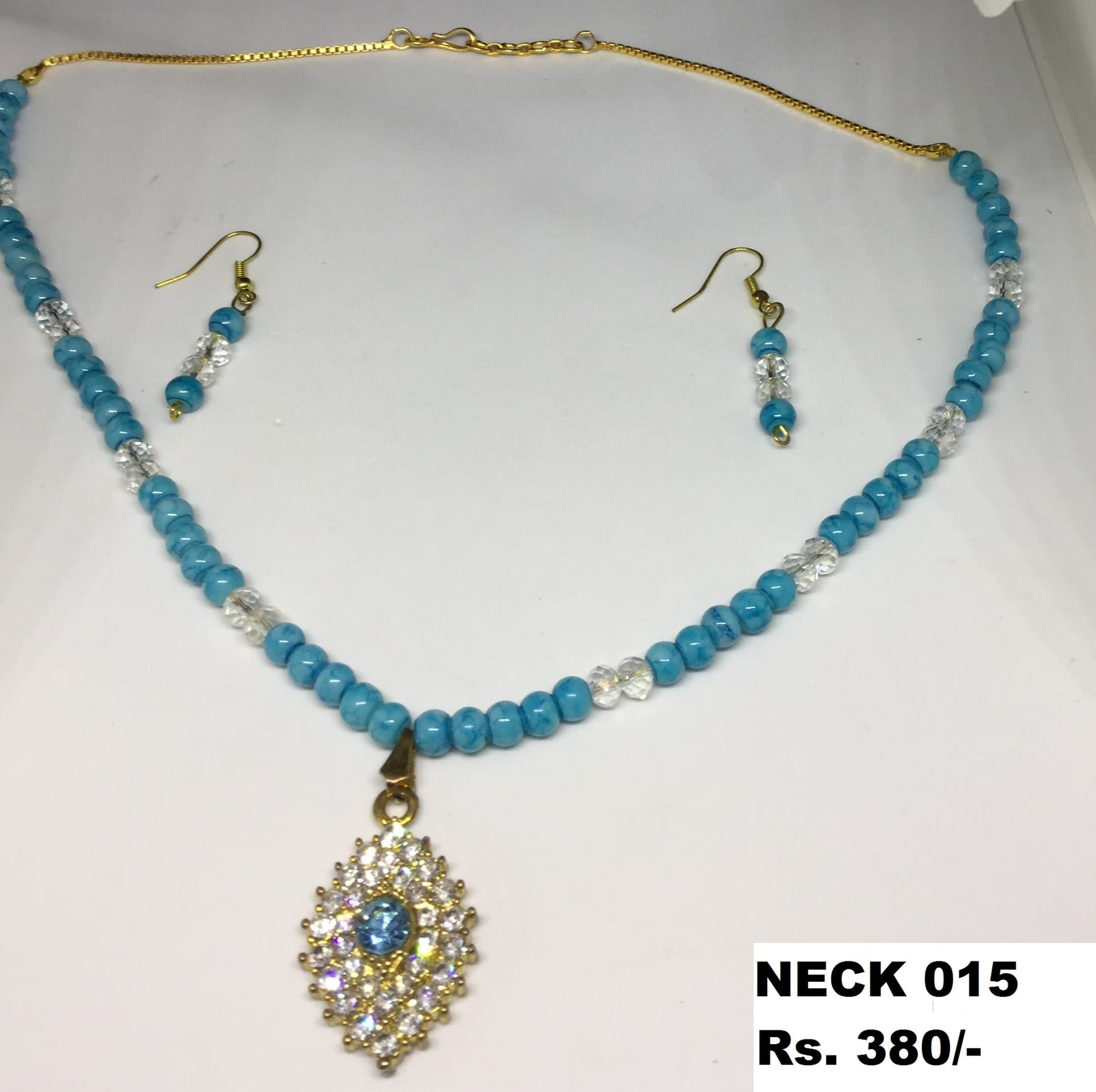 Necklace and earring set — turquoise blue with a silver pendant