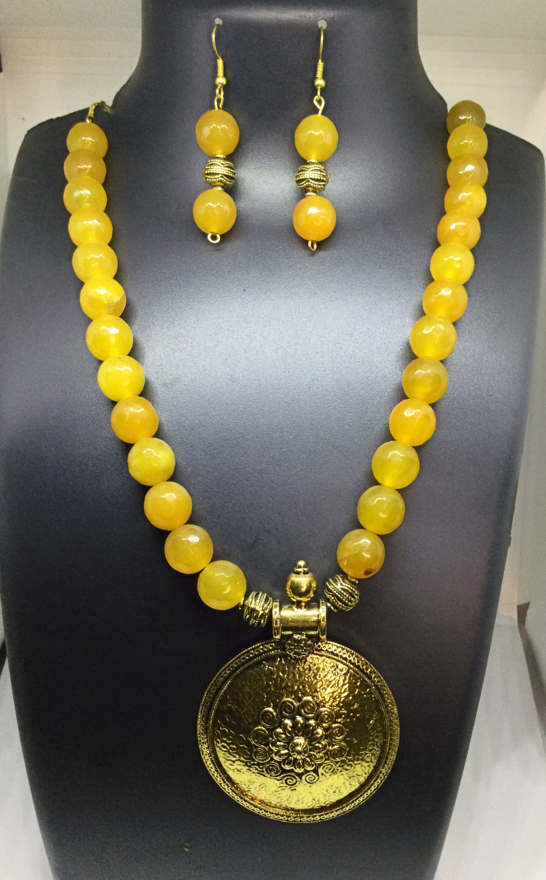 Necklace and earring set — yellow with a gold medallion