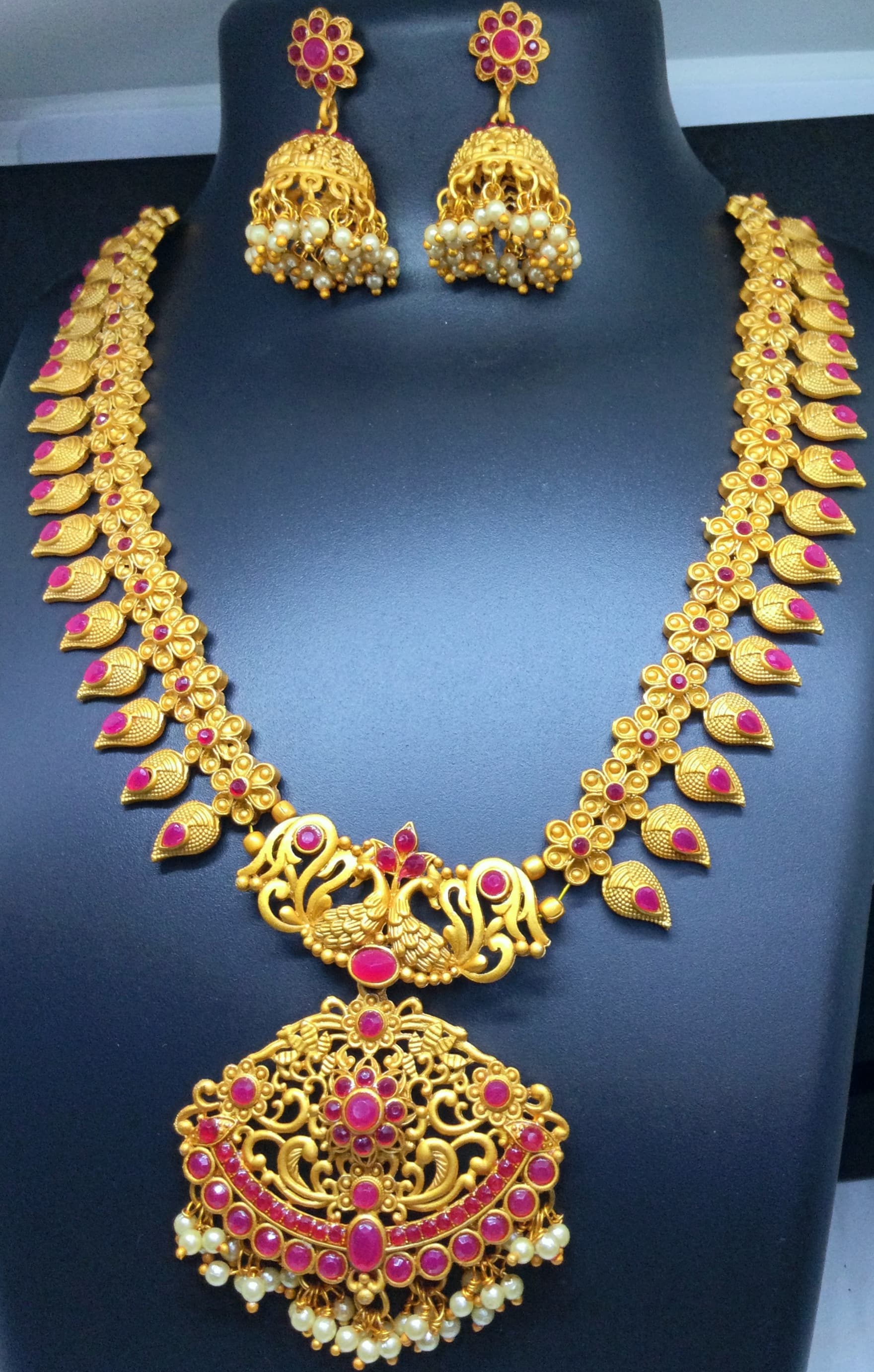Necklace and jhumka earring set — gold with pink and green stones