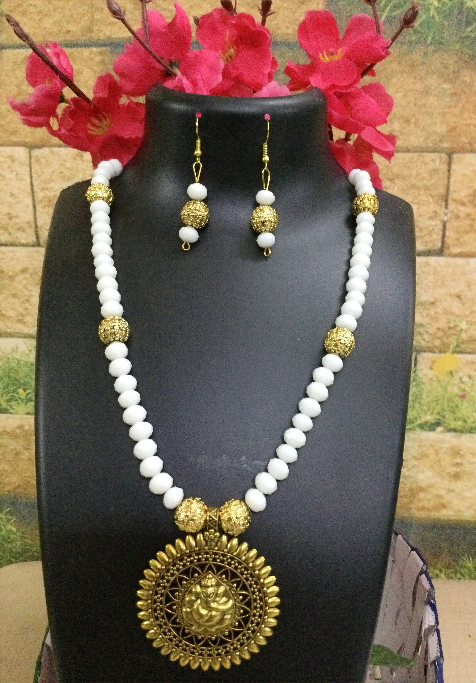 Necklace and earring set — white and gold with a gold medallion