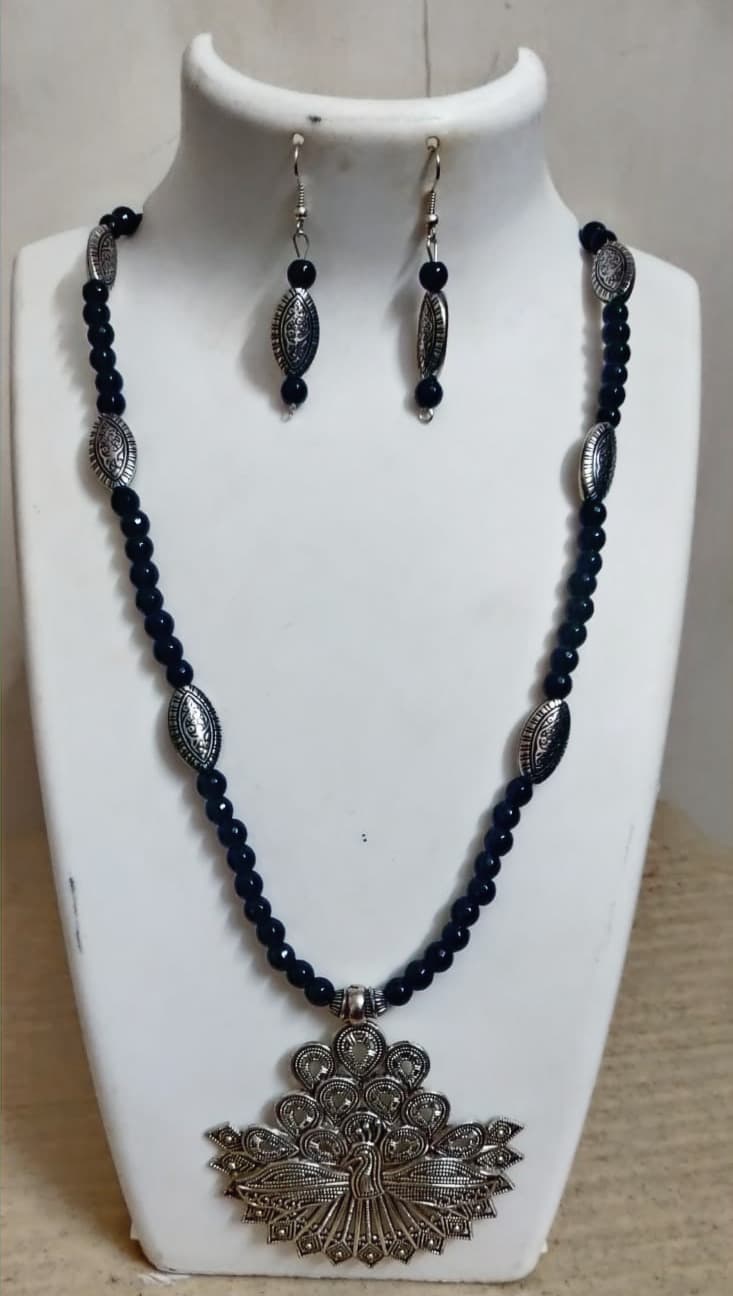 Peacock necklace and earring set — black with a silver peacock pendant