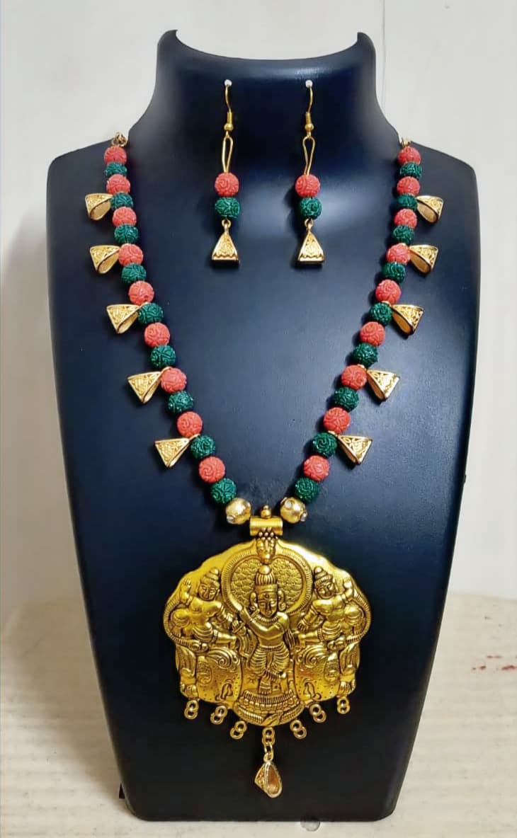 Necklace and earring set — peach and coral with a gold peacock pendant