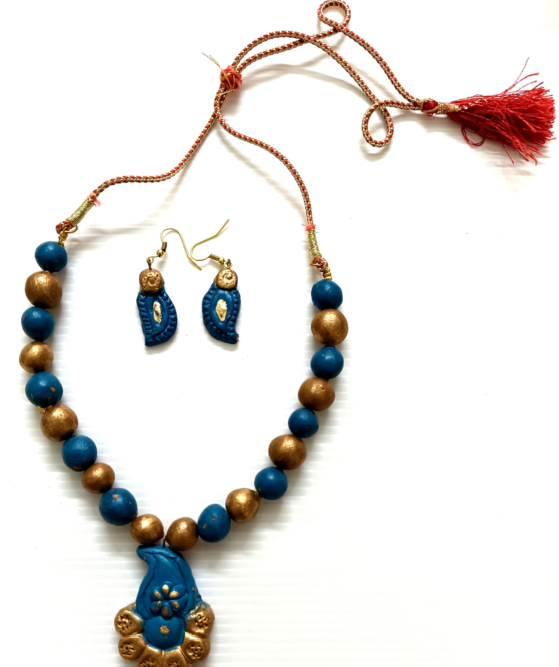 Terracotta necklace and earring set — teal and gold with a blue pendant