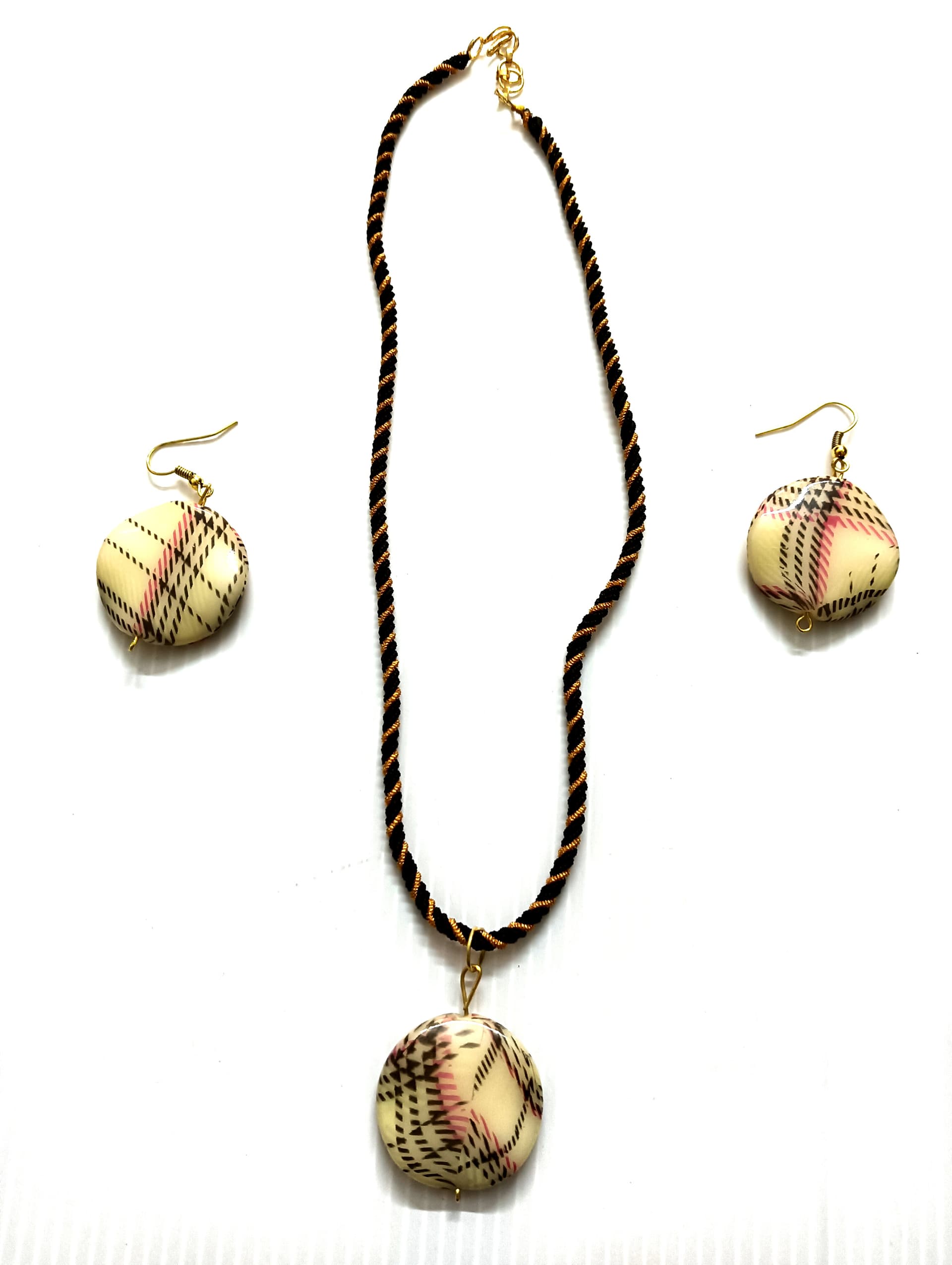Necklace and earring set — black and gold with a cream pendant