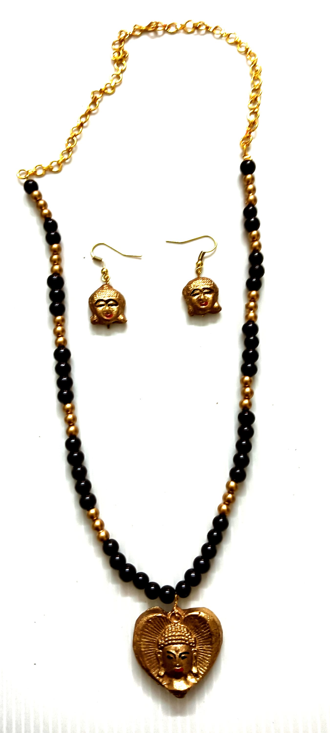Necklace and earring set — navy with a brass pendant