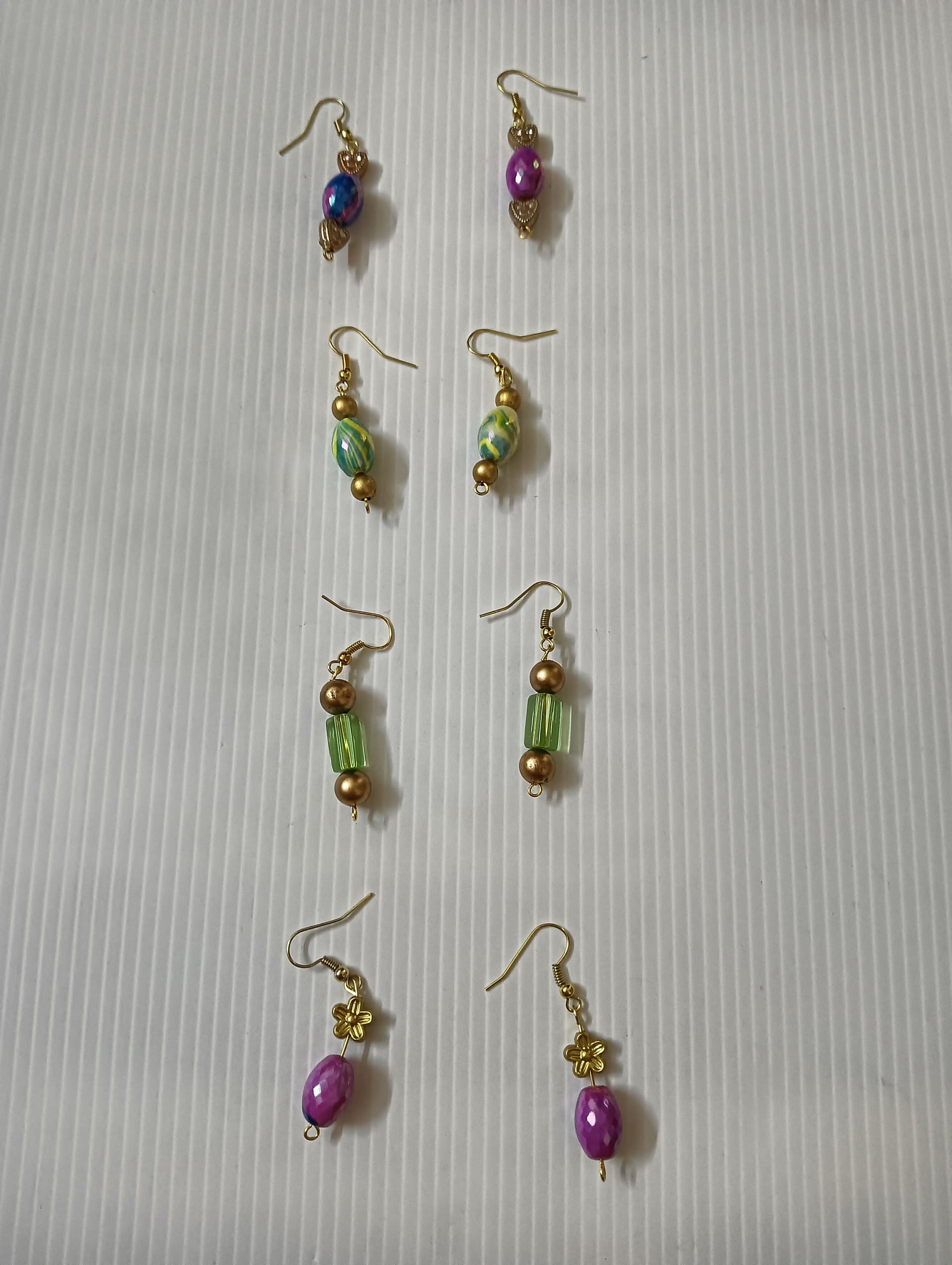 Handmade earrings — green and violet beaded drops