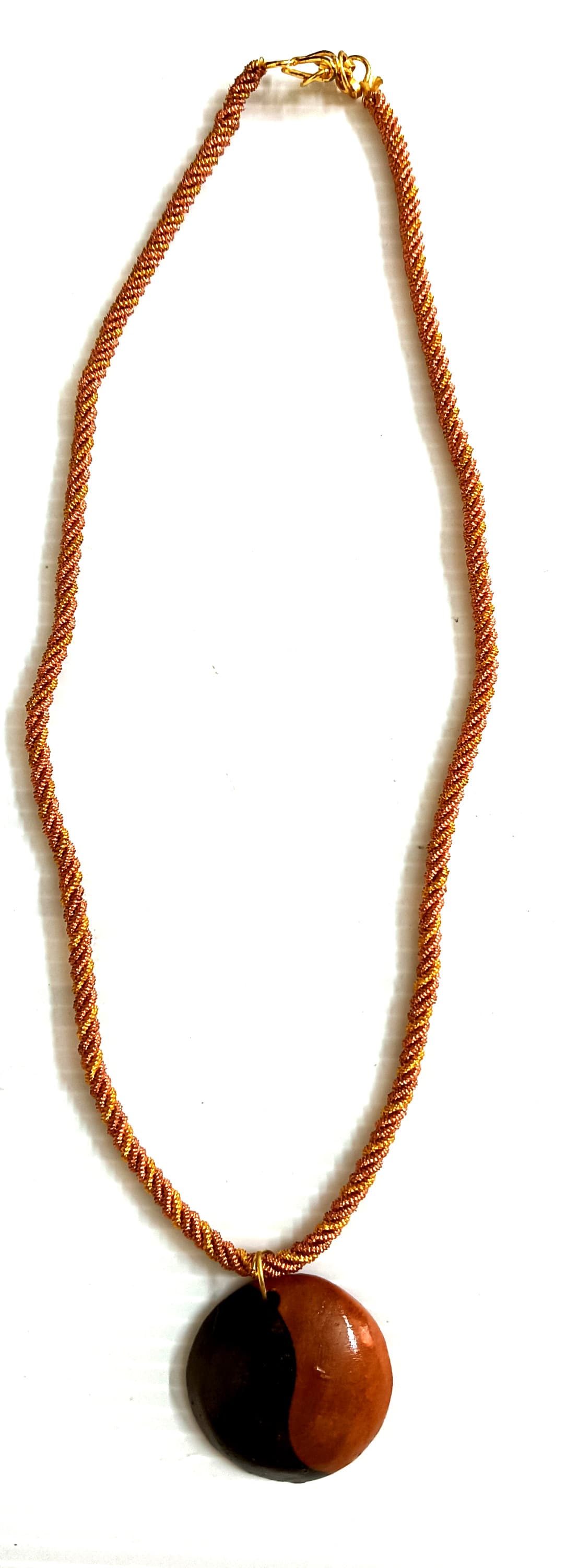 Handmade necklace — tan cord with a wooden disc pendant