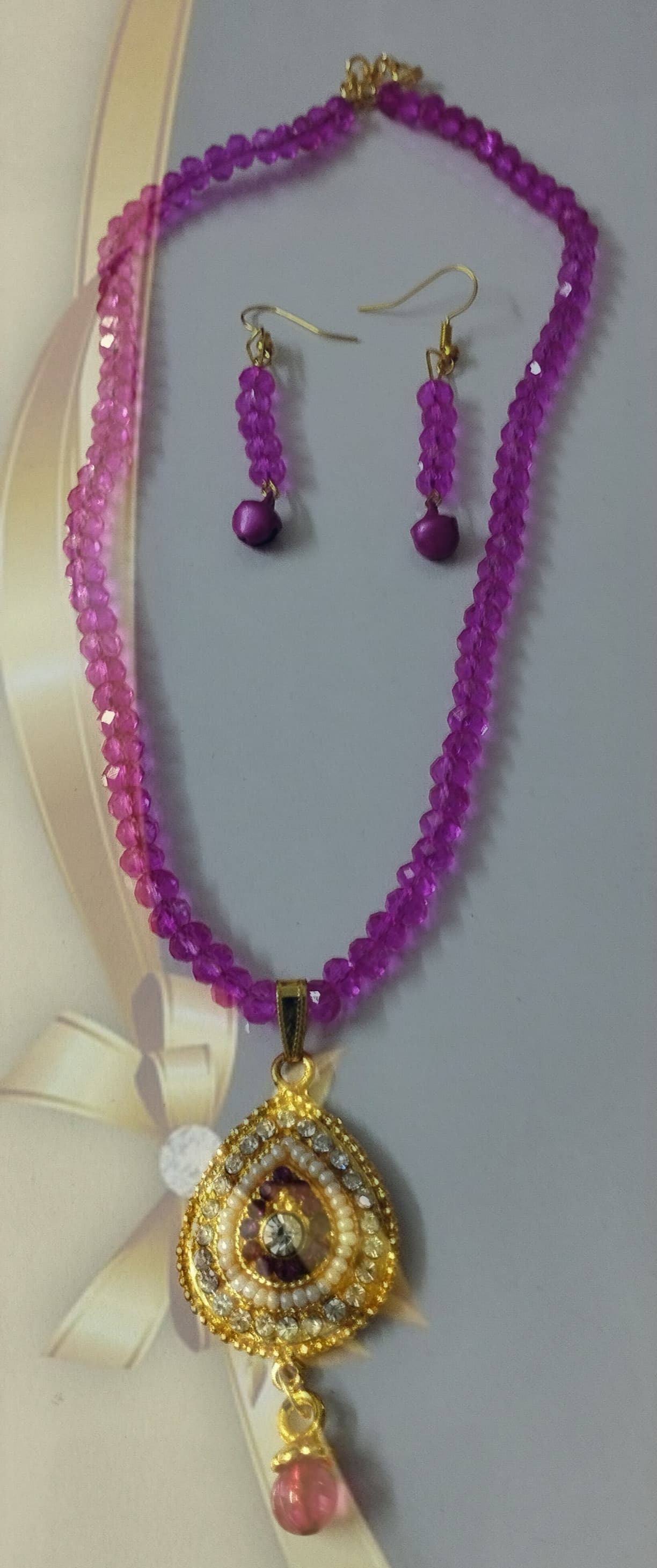 Necklace and earring set — violet and pink with a gold pendant