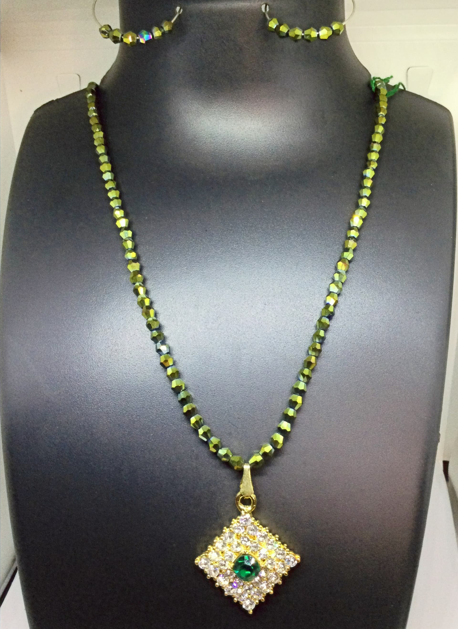 Handmade necklace — olive green with a gold square pendant