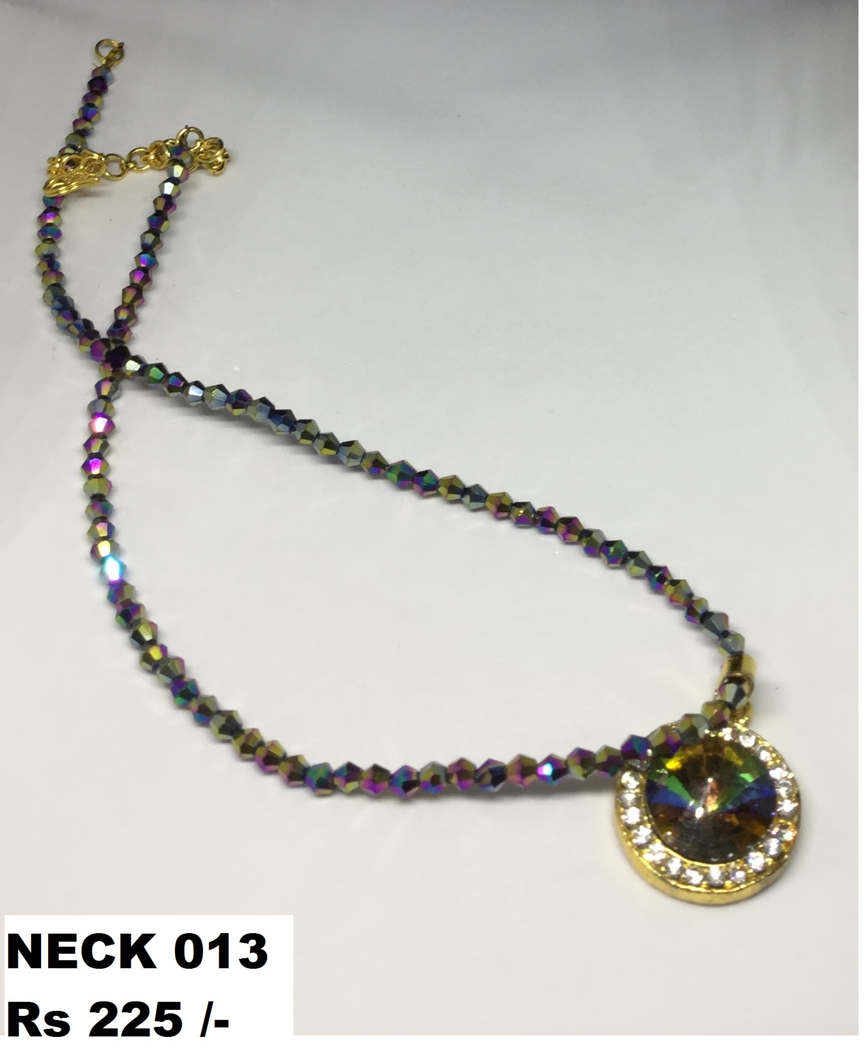 Handmade necklace — multicolour with a black and gold medallion
