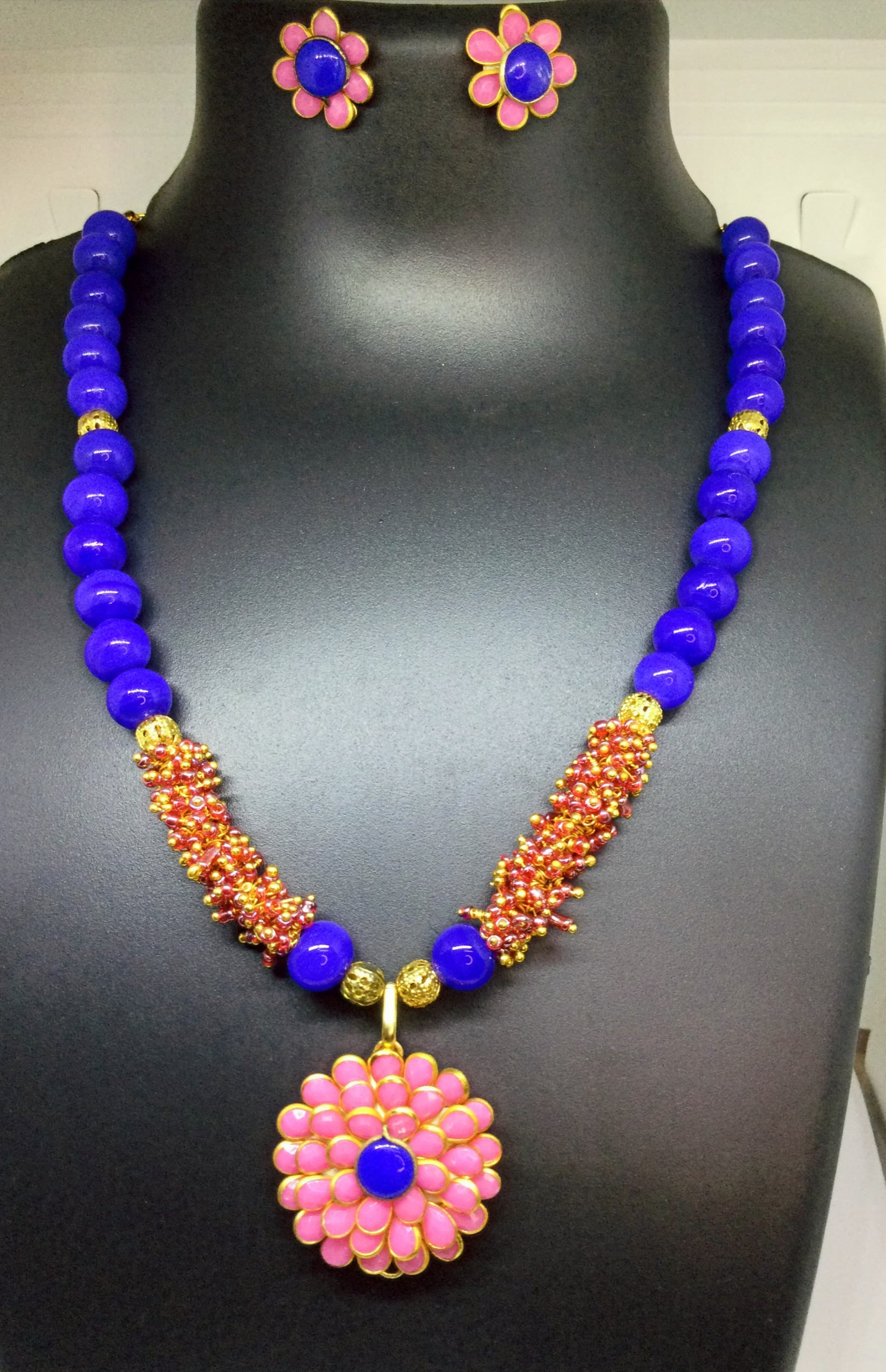 Necklace and earring set — royal blue and orange with a pink flower