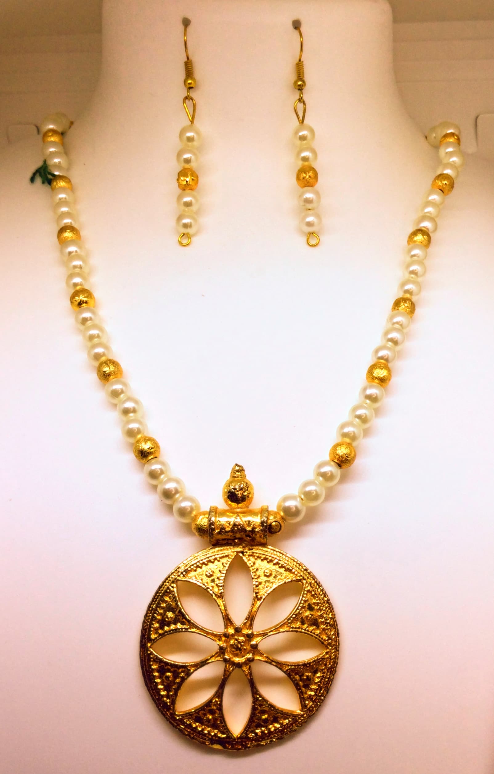 Necklace and earring set — gold with a gold flower medallion