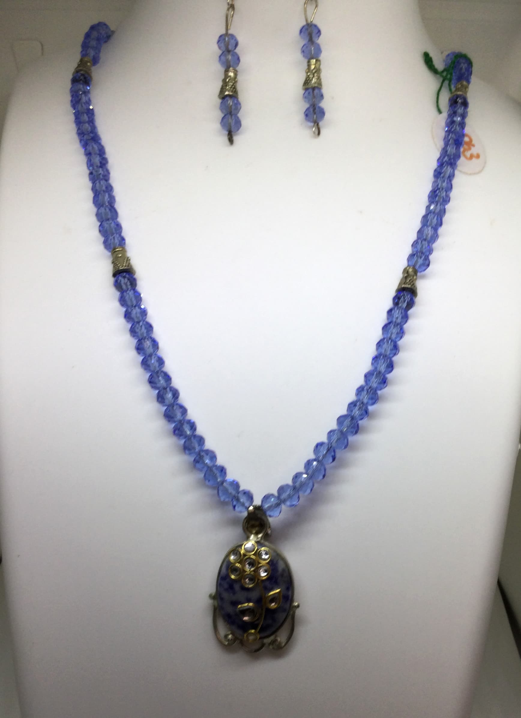 Necklace and earring set — blue with a dark stone pendant