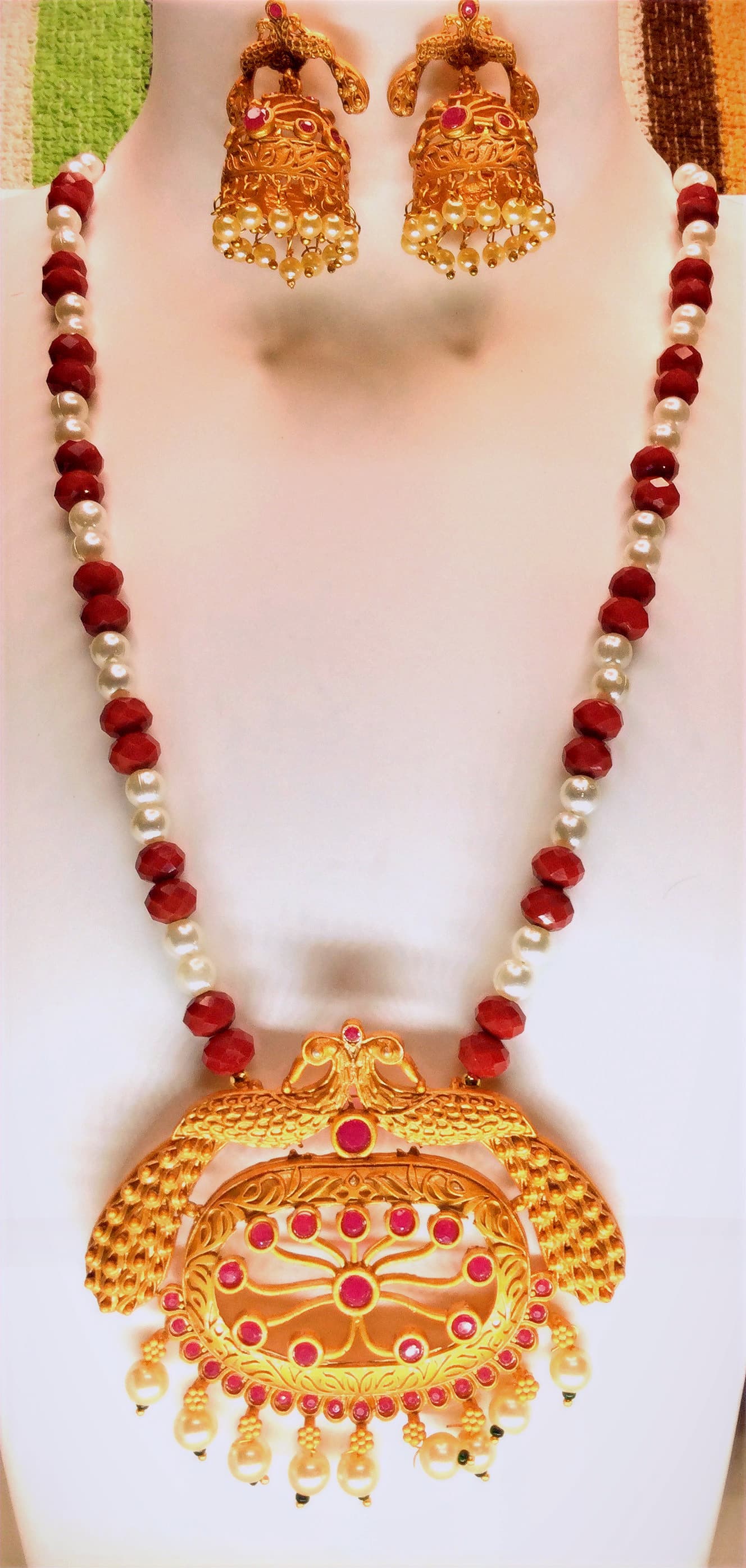 Necklace and jhumka earring set — red and gold with a temple pendant