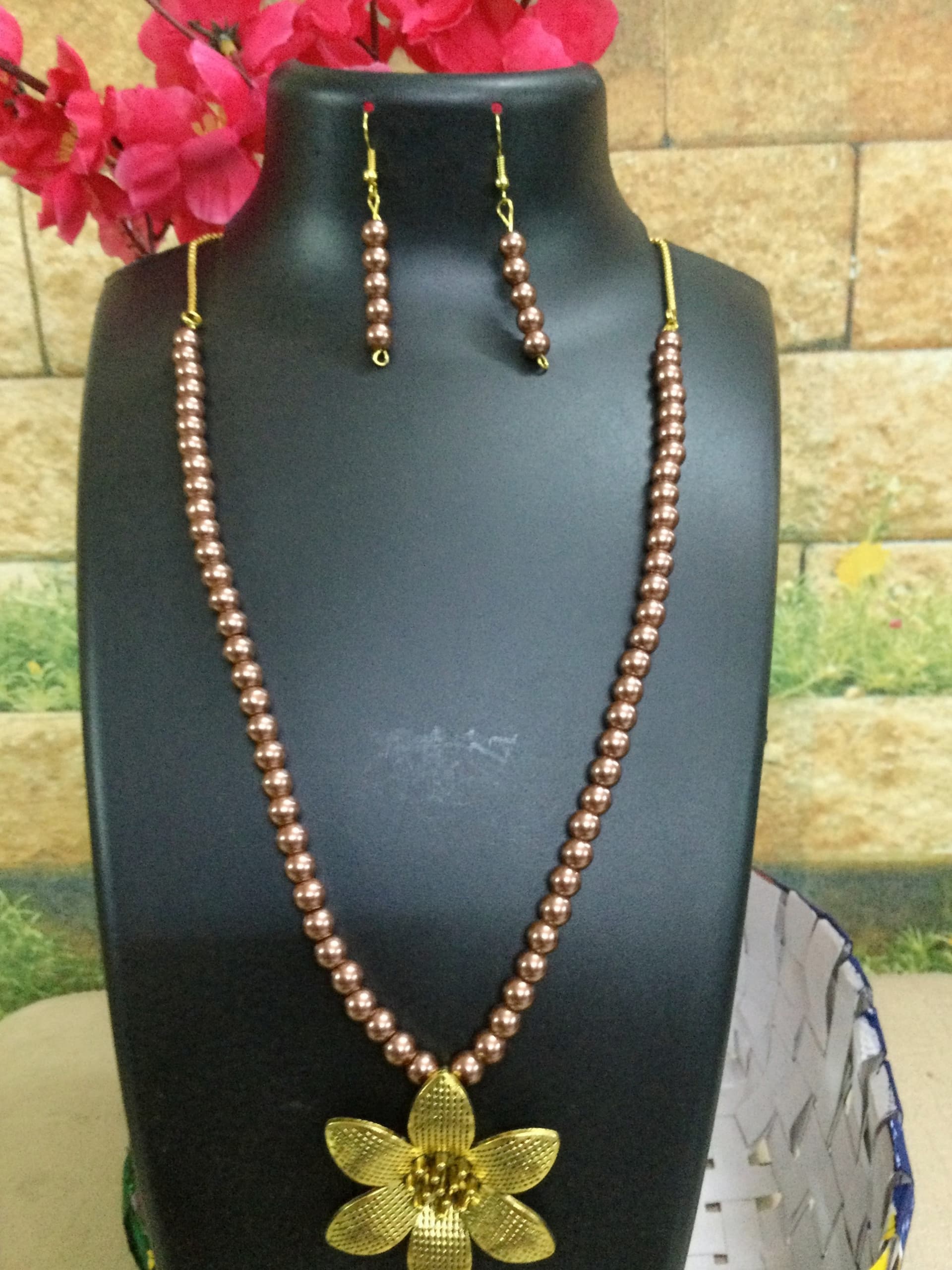 Necklace and earring set — peach with a gold flower pendant