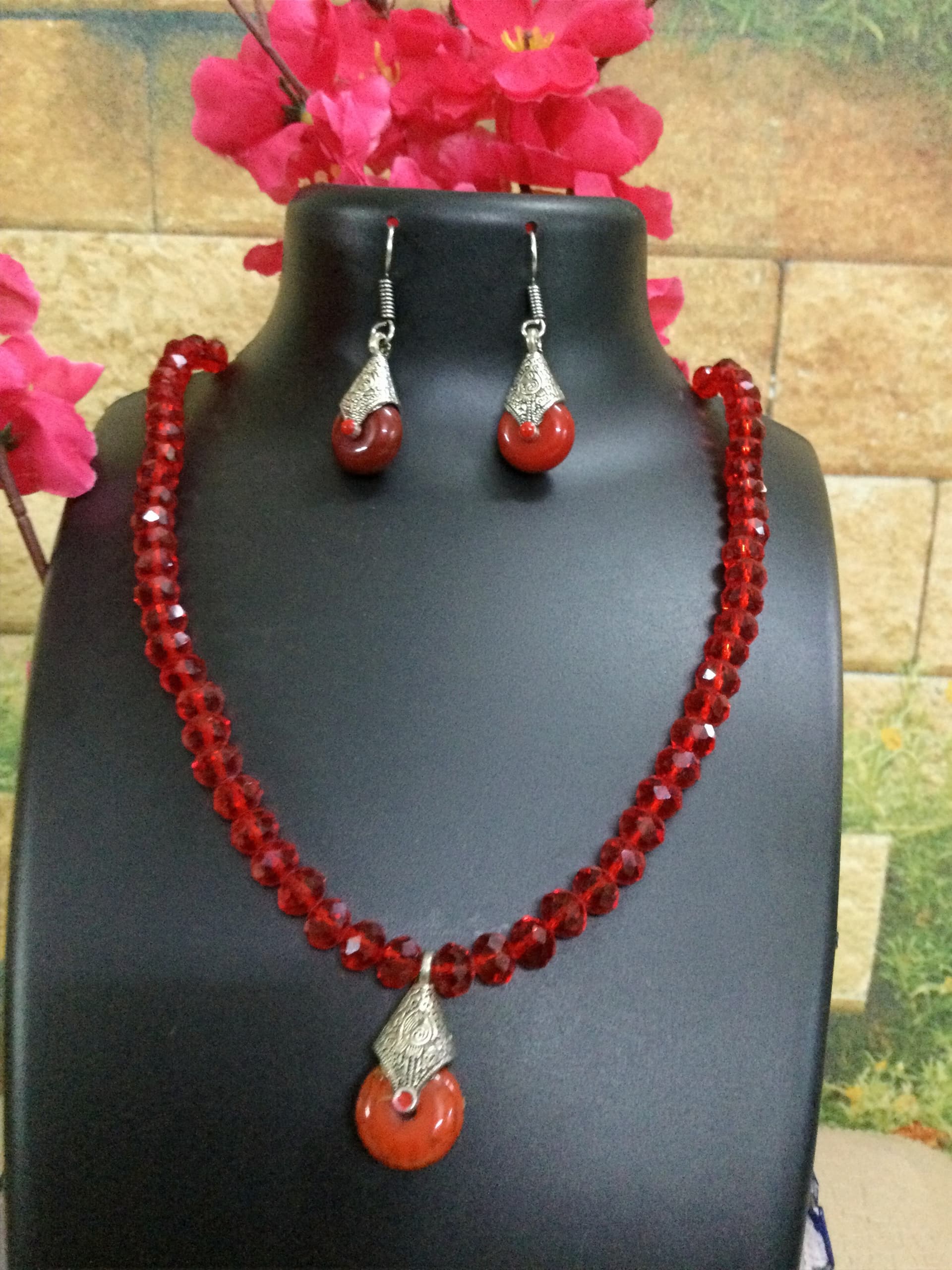 Necklace and earring set — red with an orange stone pendant