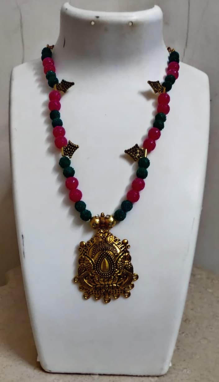 Necklace and earring set — red and black with a brass pendant