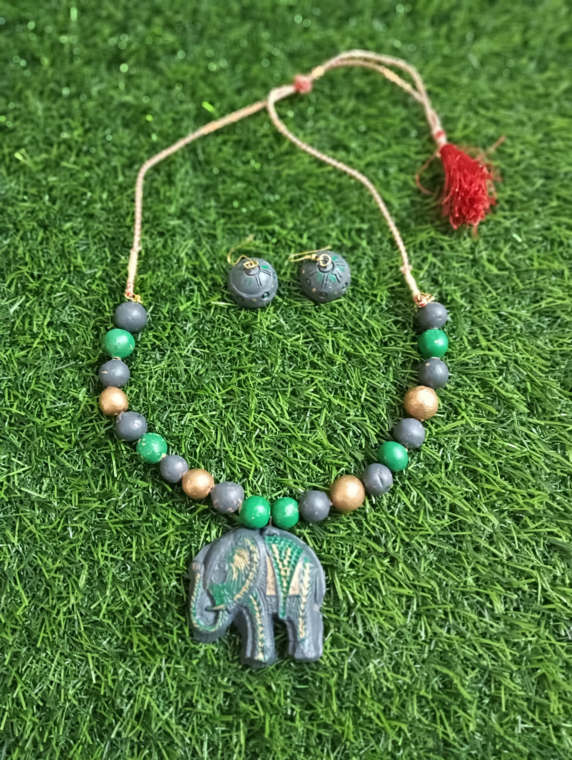 Necklace and earring set — grey and blue with a stone elephant pendant