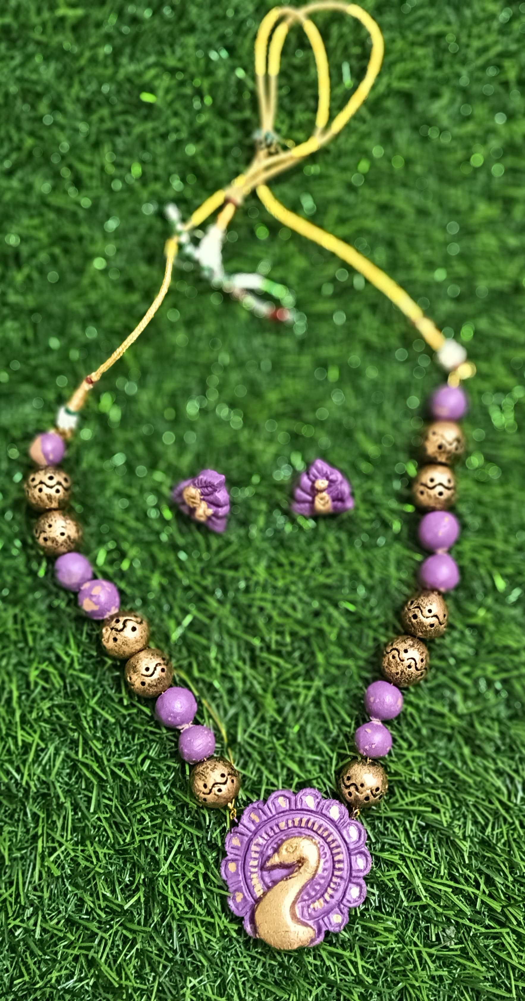Peacock necklace and earring set — violet and gold with a swirl pendant