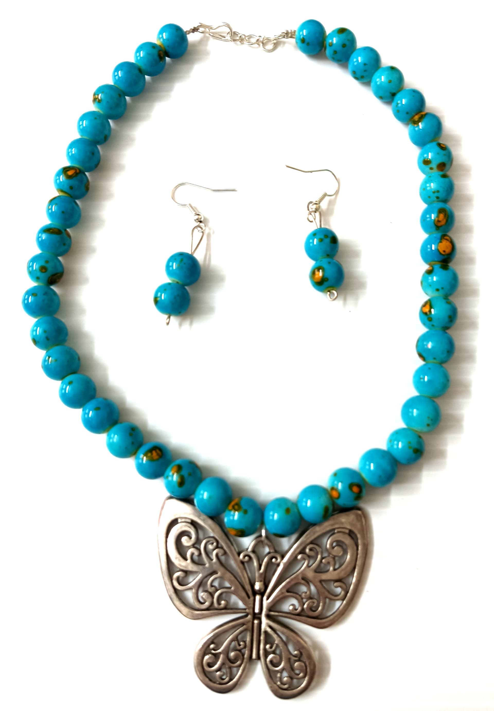 Necklace and earring set — turquoise with a silver butterfly pendant