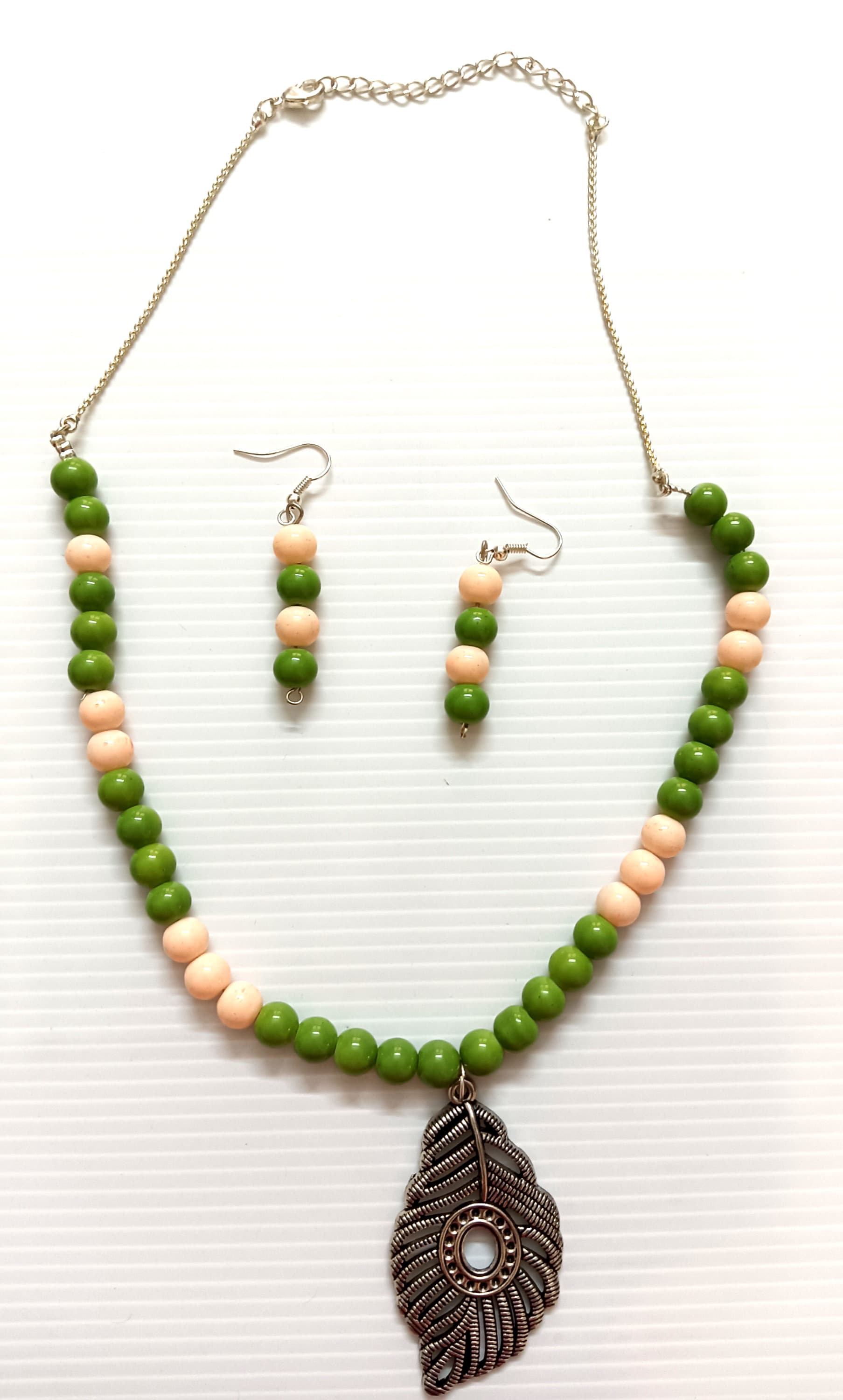 Necklace and earring set — green and peach with a brass leaf pendant