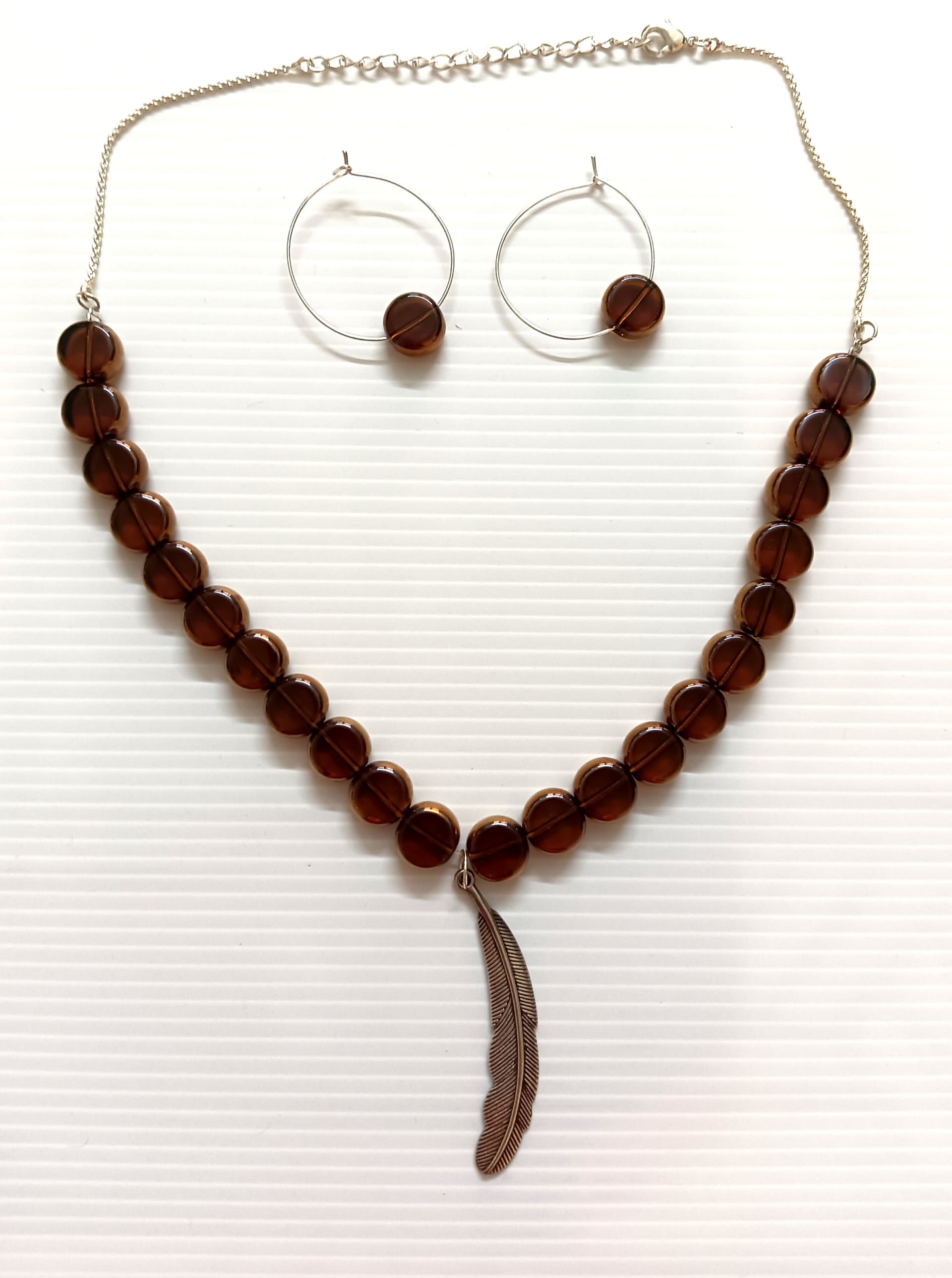 Necklace and earring set — dark brown with a brass drop