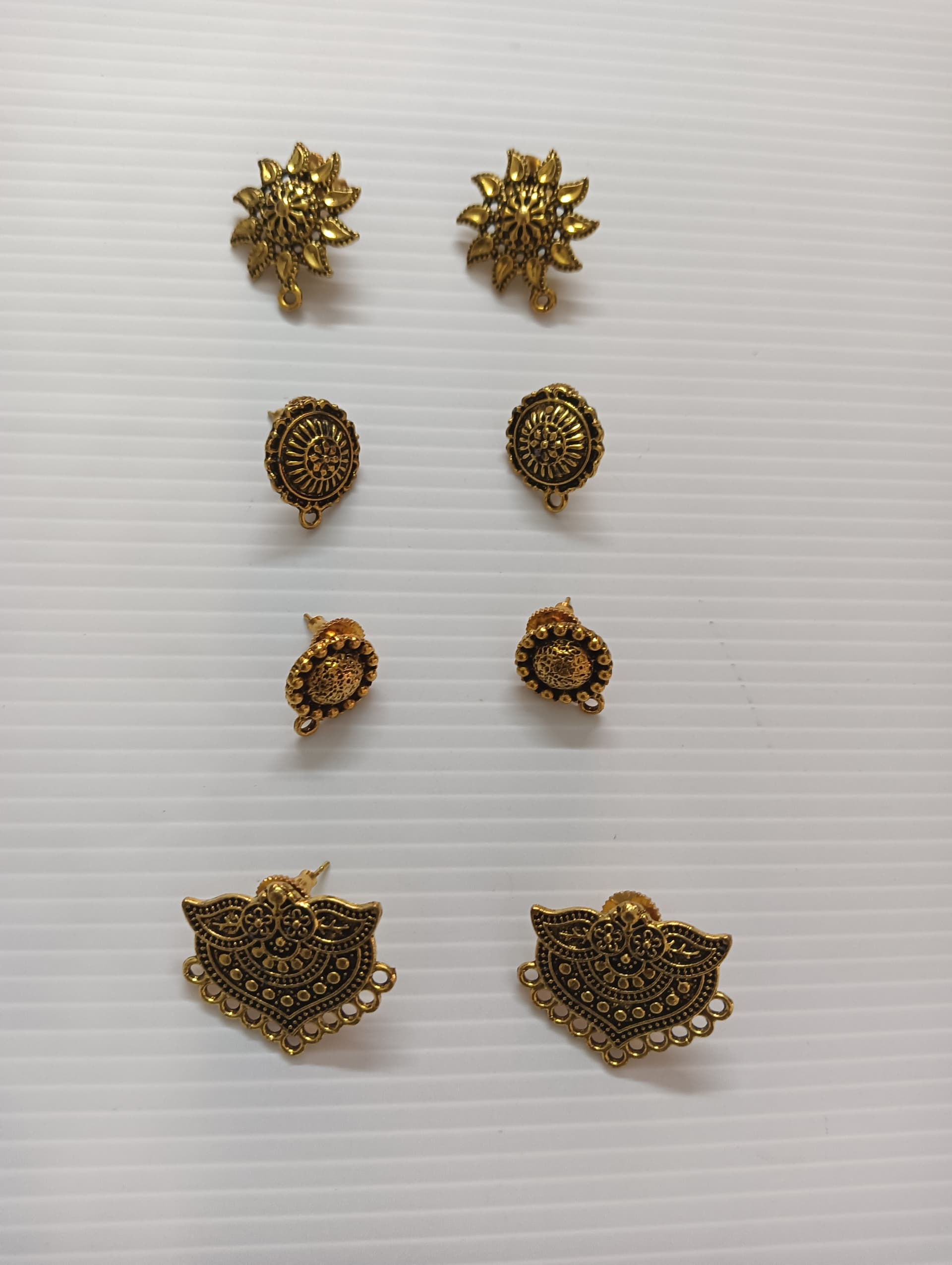 Handmade earrings — brass studs and small drops
