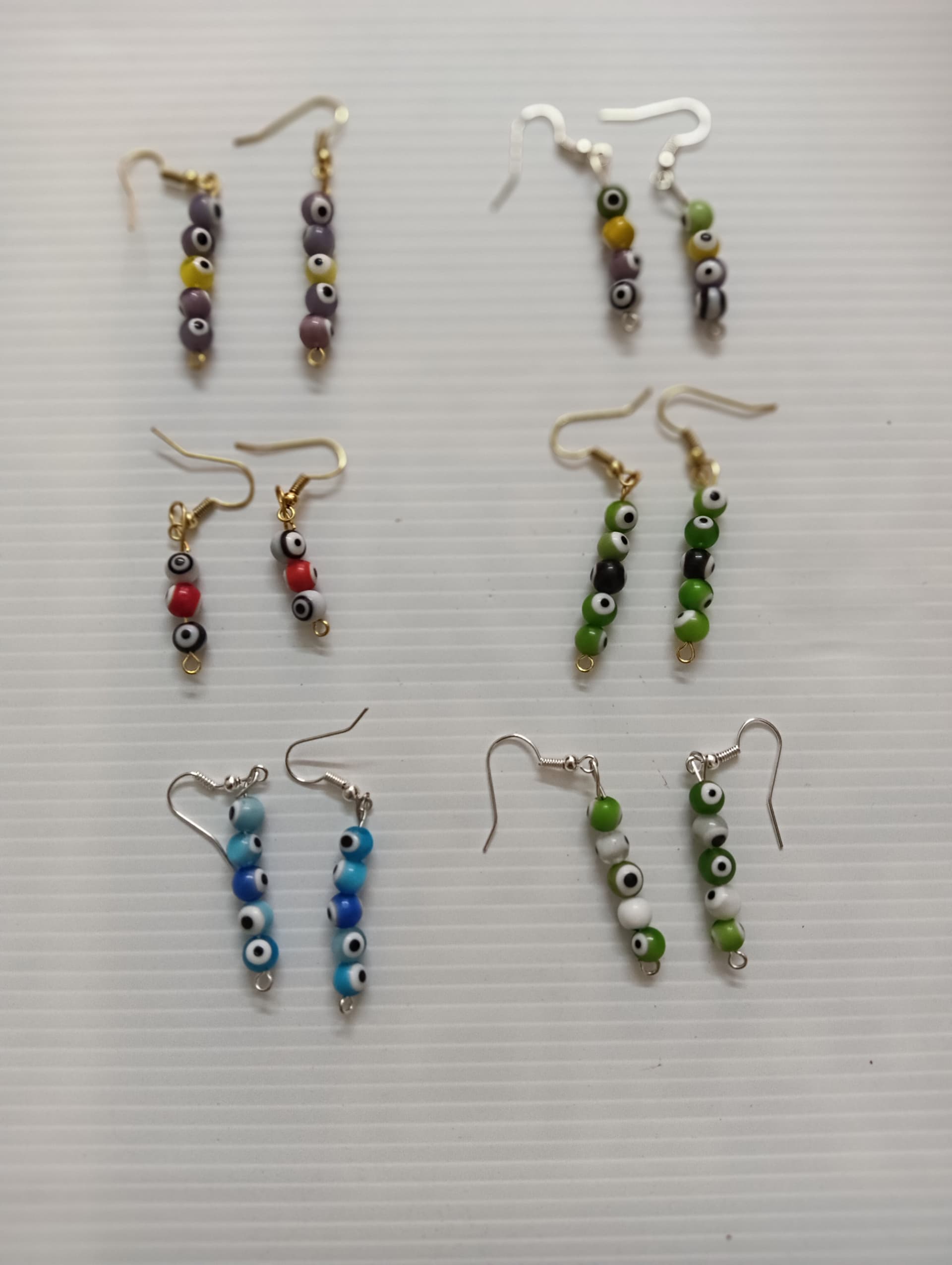 Handmade earrings — blue and green beaded bars