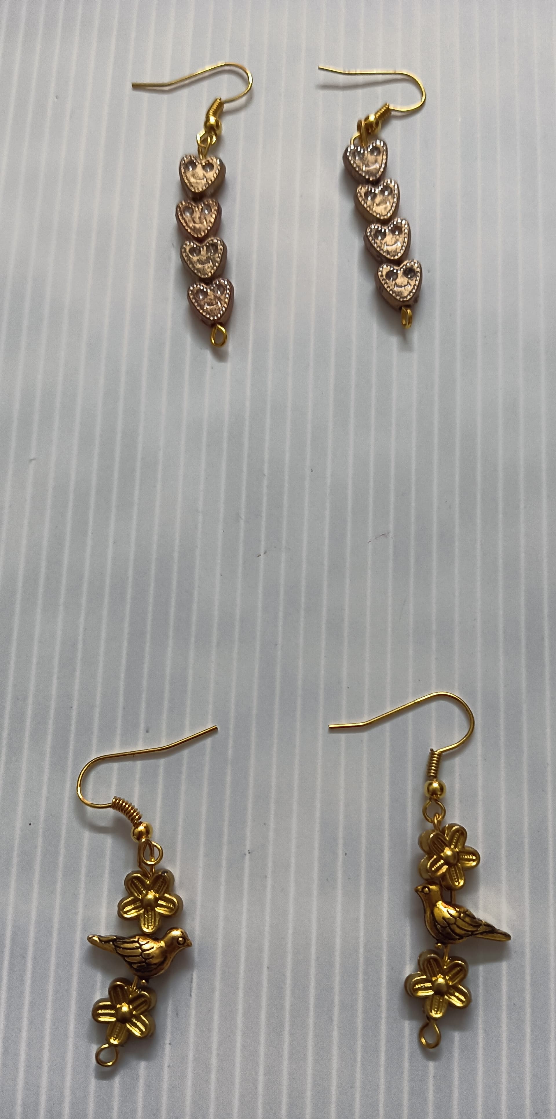 Handmade earrings — gold and cream beaded drops