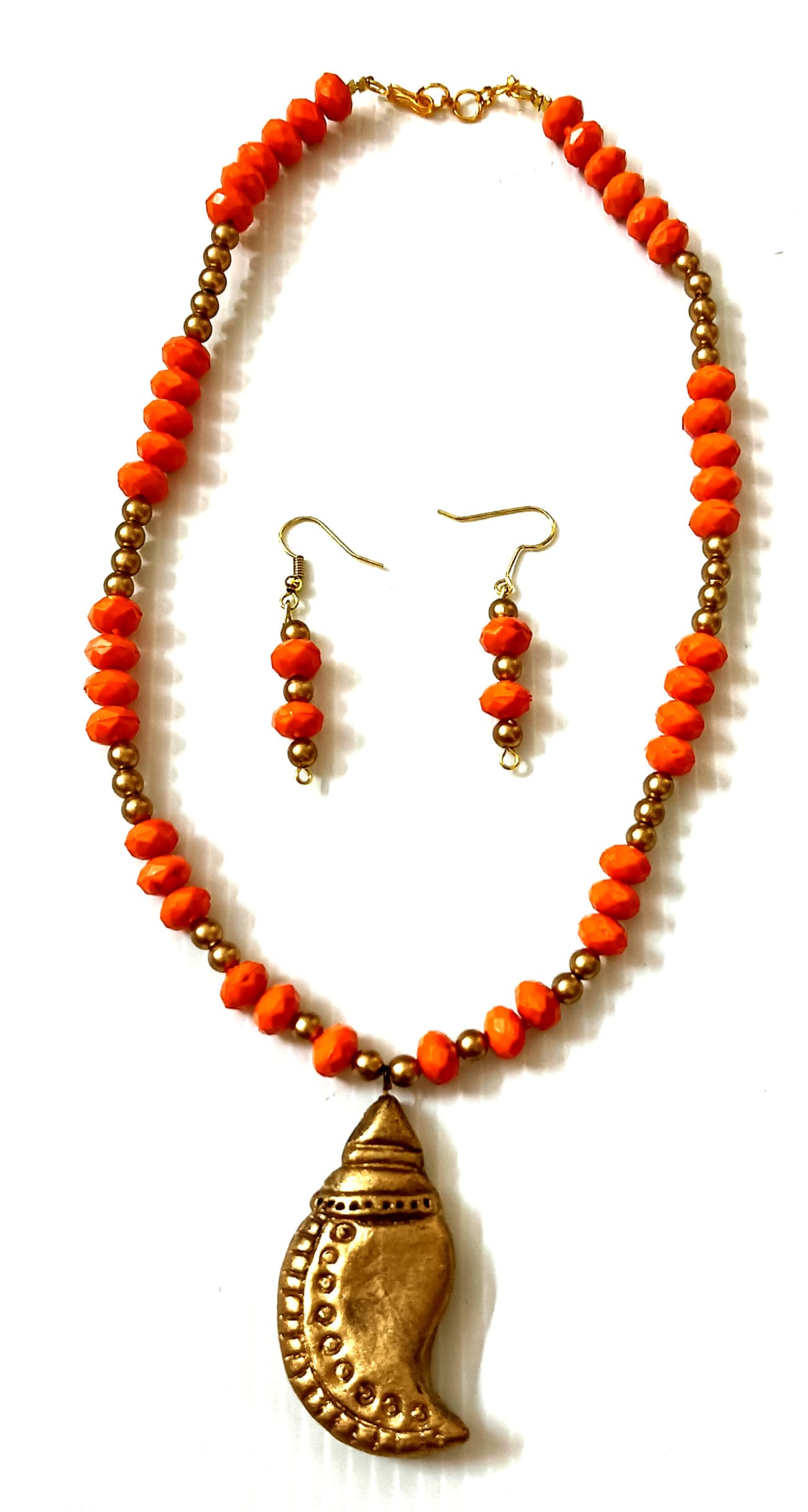 Necklace and earring set — coral with a brass paisley pendant