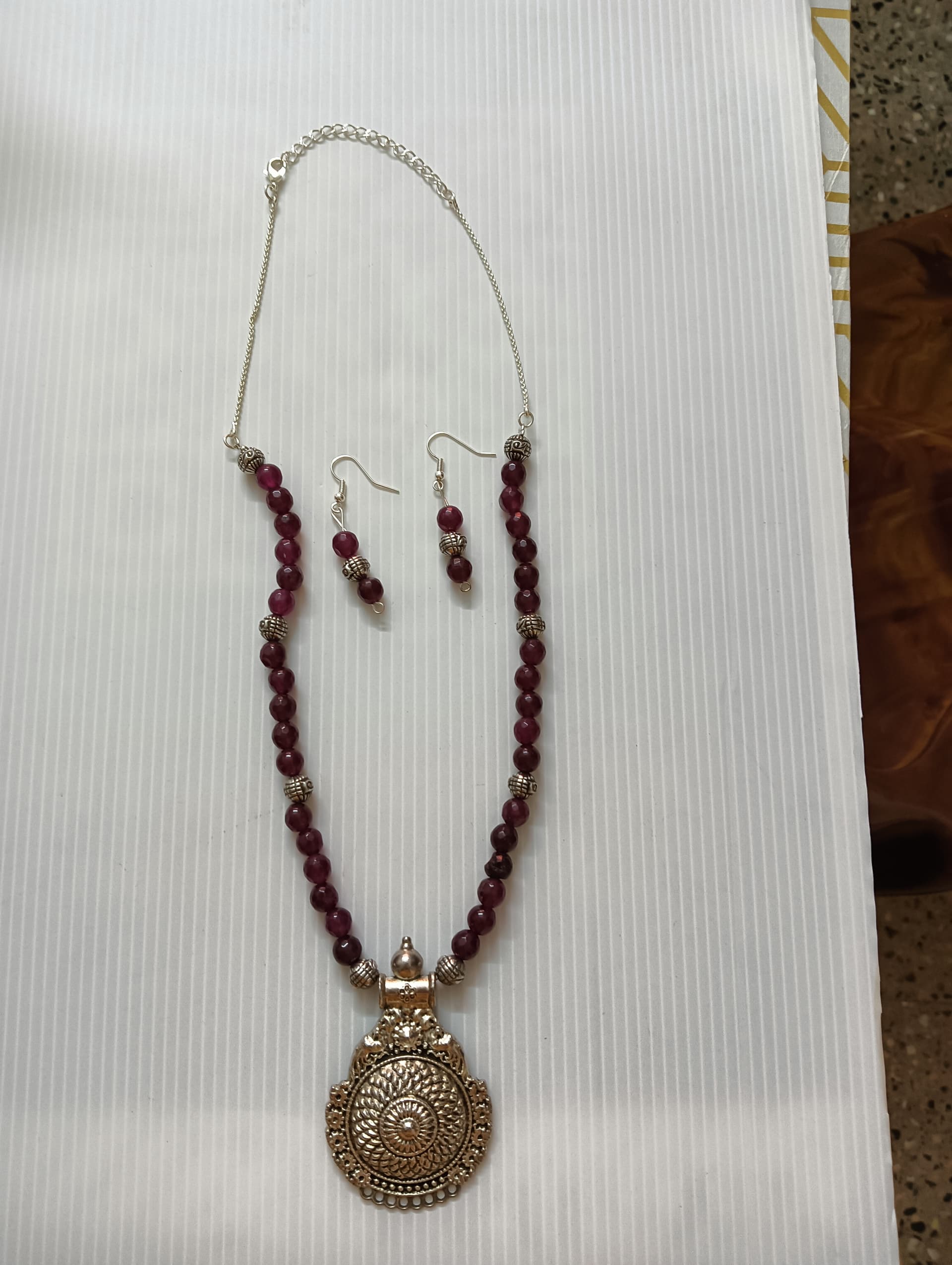Necklace and earring set — wine with a brass medallion