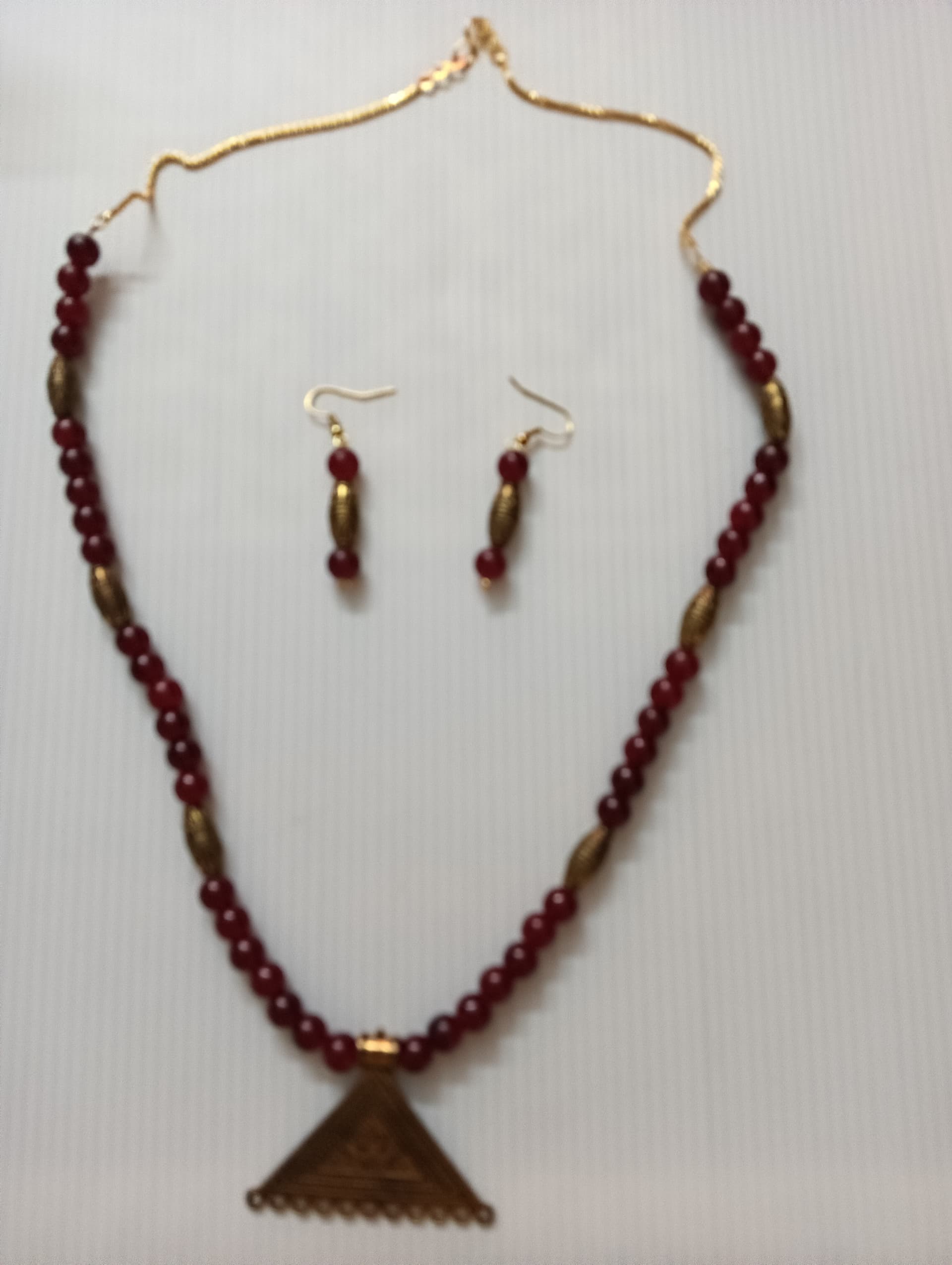 Necklace and earring set — wine with a brass triangle pendant
