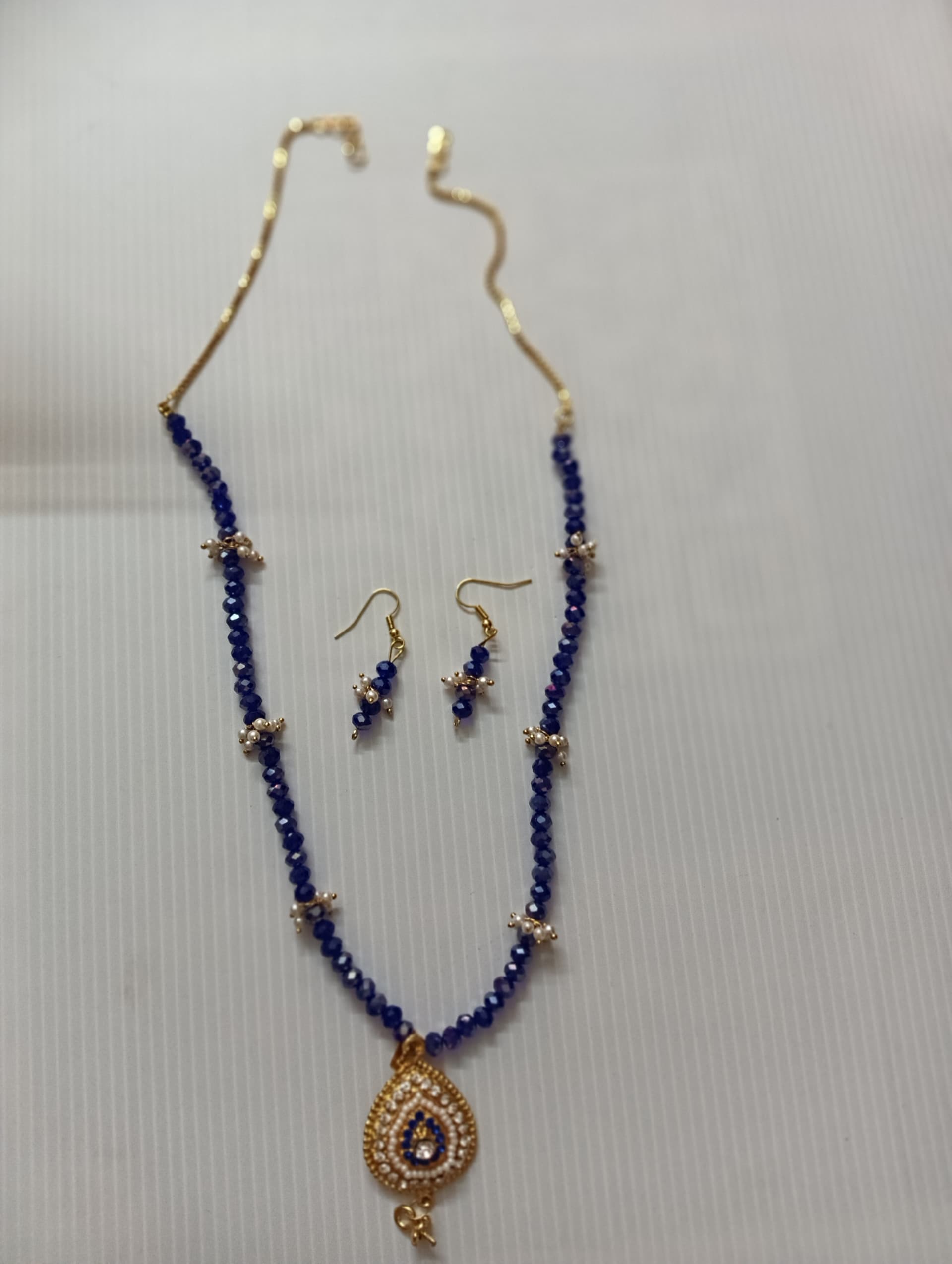 Necklace and earring set — royal blue with a brass drop