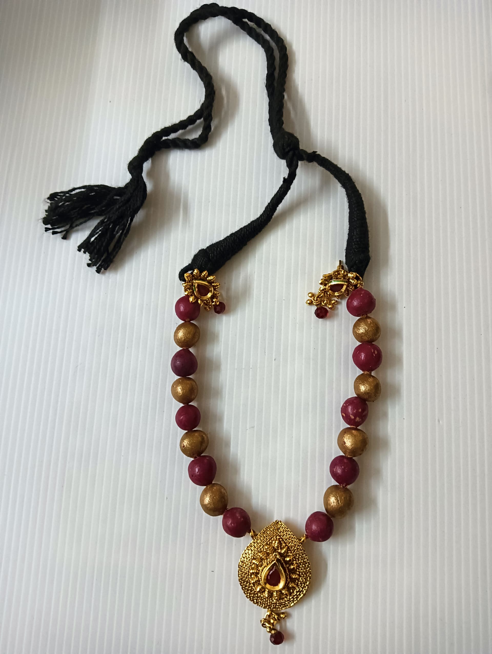Necklace and earring set — wine and gold with a brass pendant
