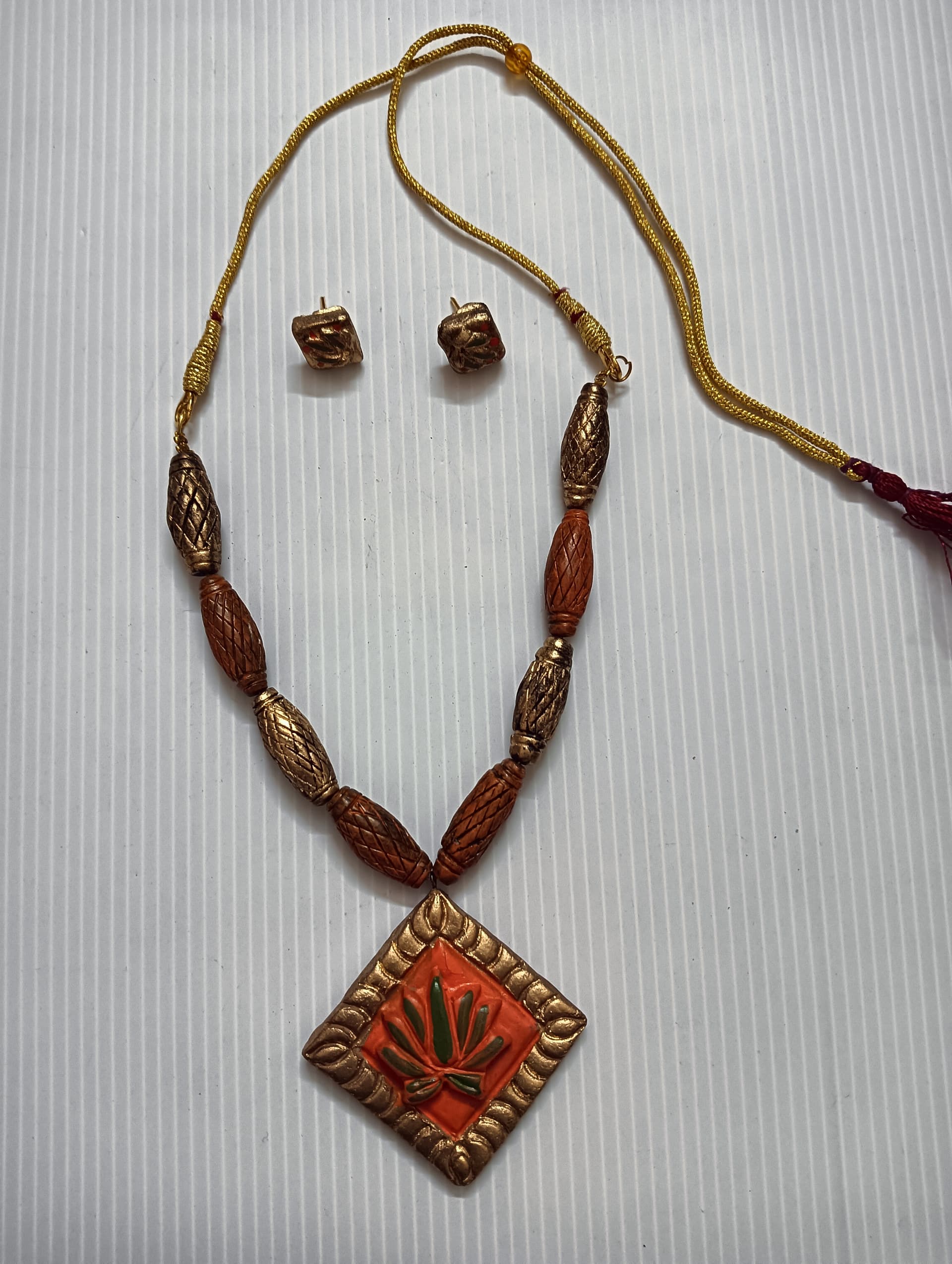 Terracotta necklace and earring set — tan cord with an orange painted diamond