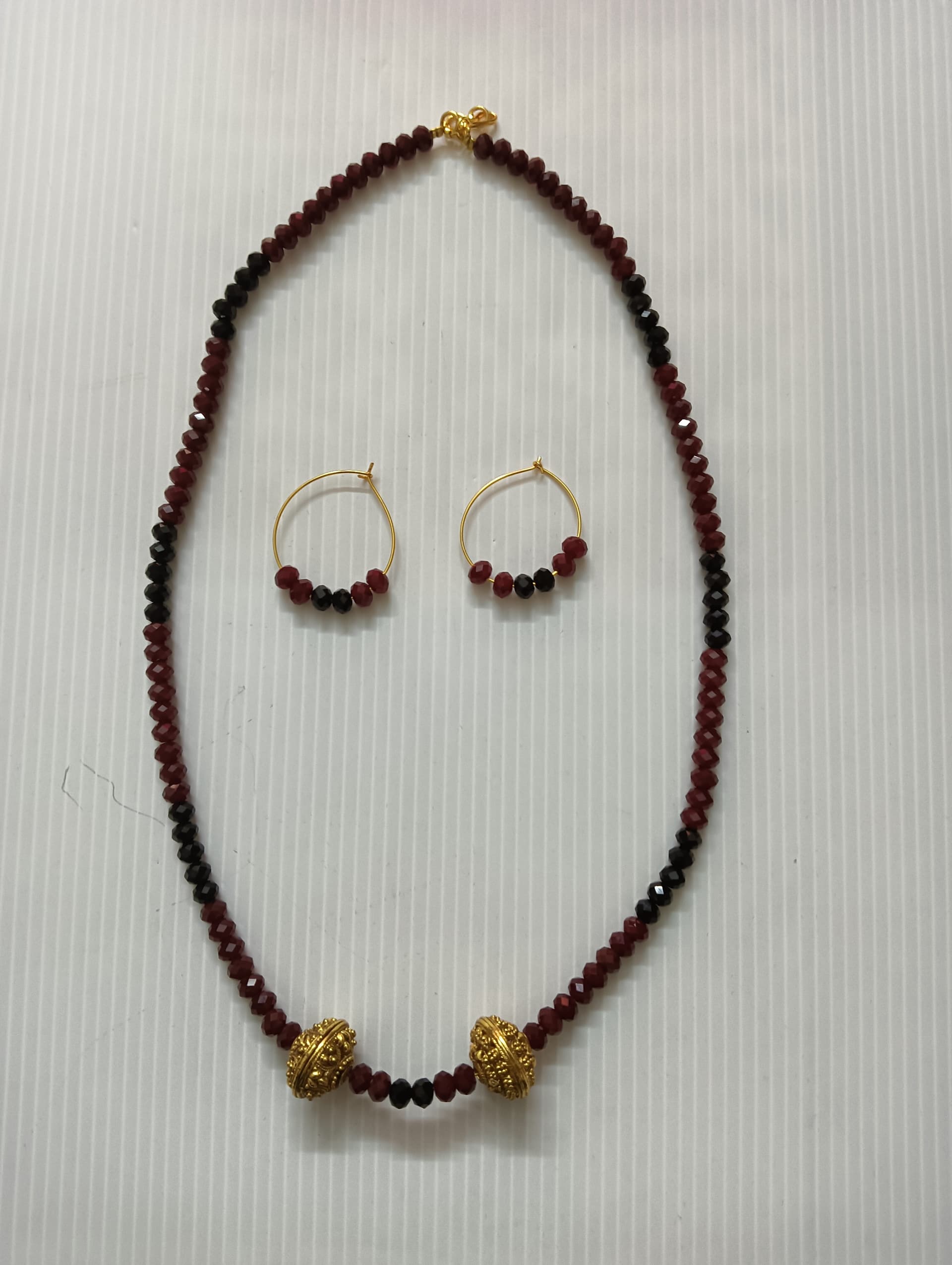 Necklace and earring set — dark brown with a gold