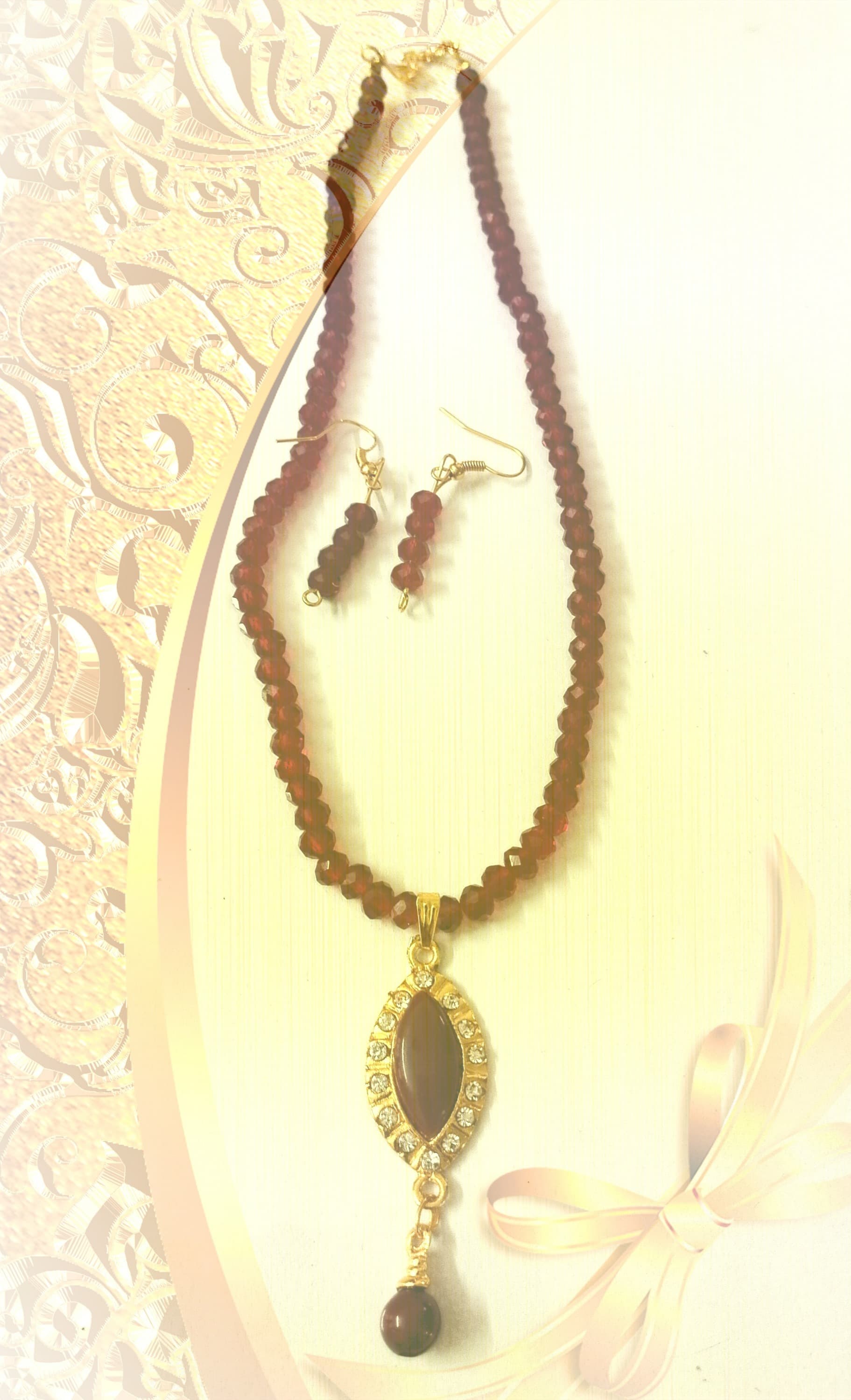 Necklace and earring set — brown with a gold and amber pendant
